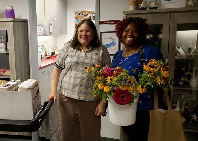 two women with flowers