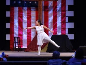 Woman dancing at the Aspire Living & Learning talent show.